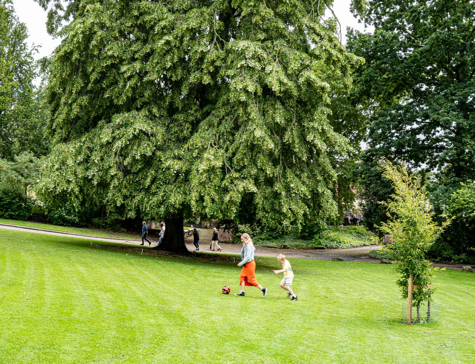 Mother and son playing football in Memorial Gardens, Philip Dearle